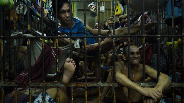 Prisoners incarcerated as part of Duterte's unprecedented crackdown on illegal drugs crowd a cell in the Manila Police Headquarters.