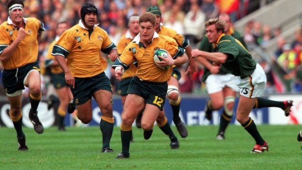 Cup winner: Tim Horan in action against the Springboks at the 1999 World Cup.