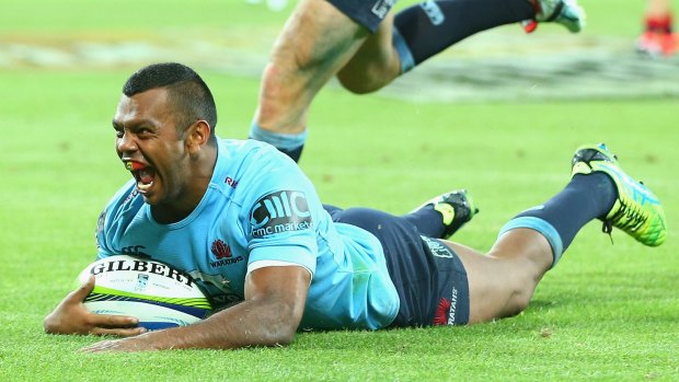 The Beale-breaker: Kurtley Beale goes for the clinching try late on against the Rebels.