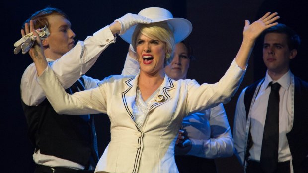 Jake Willis, Esther Ramsay, James Tighe and Kelly Roberts as Eva Peron in Canberra Philharmonic's production of Evita. 