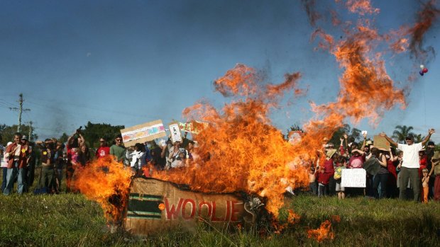 Locals set fire to a box with Woolies signage during a protest in Mullumbimby against a proposal to build a Woolworths in town in 2008.
