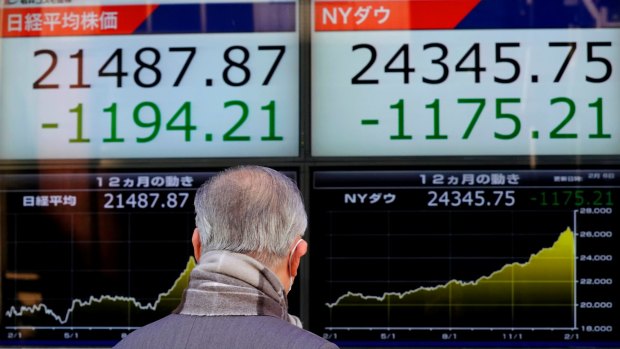 The record falls reverberated around the world including Tokyo, where shares tumbled on Tuesday for another wild day. 