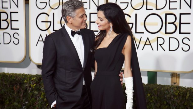George Clooney and wife, Amal Clooney, at the 2015 Golden Globe Awards.