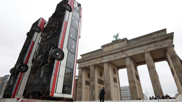 'Monument', an installation of three buses close to the Brandeburg Gate in Berlin, Germany, by Syrian artist Manaf Halbouni act as a reminder of the suffering of civilians in his country.