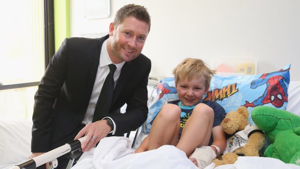 Inspiration: Michael Clarke poses with Rowan after he announced his plan to join the Perpetual Loyal yacht racing team for the 2015 Sydney Hobart yacht race at Sydney Children's Hospital.