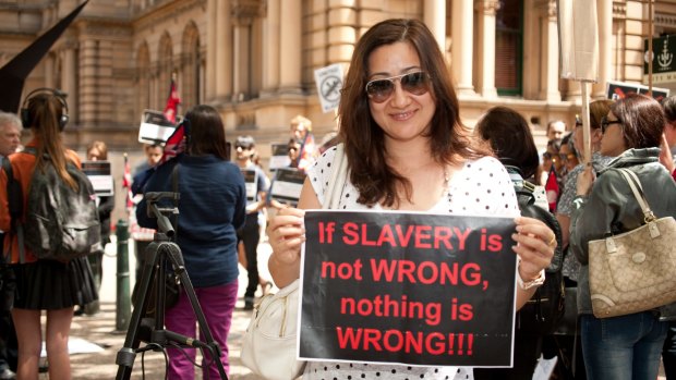 Protestors rally against slavery of migrant workers in Qatar in Sydney in 2013. 