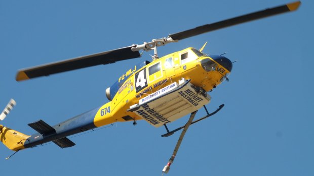 A helicopter battles the blaze in Kensington. 