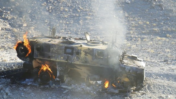 A Coalition vehicle after being hit by an improvised explosive device.