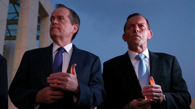 Opposition Leader Bill Shorten and Prime Minister Tony Abbott during a candlelight vigil for Andrew Chan and Myuran Sukumaran at Parliament House on Thursday. 