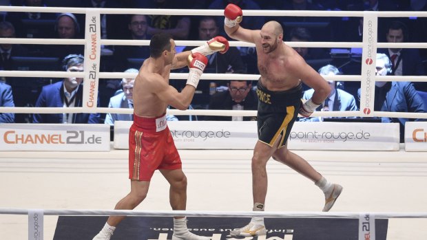 Taunt: Ukraine's Wladimir Klitschko, left, is provoked by Britain's Tyson Fury in the Esprit Arena in Duesseldorf.