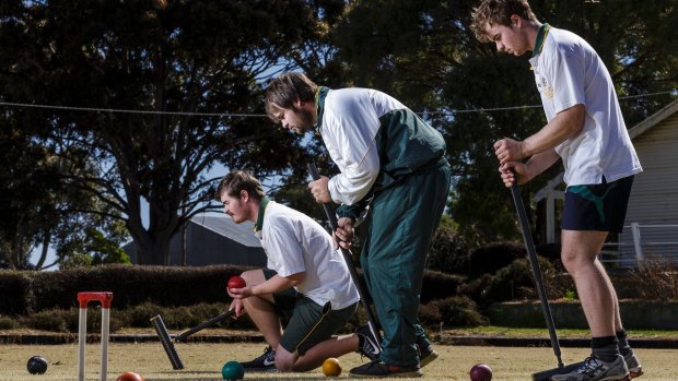 Concentration: (left to right) Greg, Robert and Mal Fletcher at Lismore Croquet club in western Victoria.