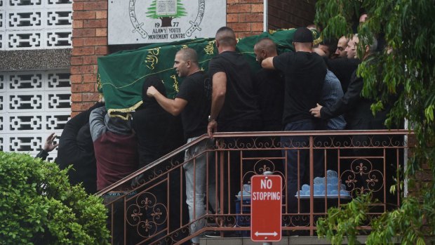 Kemel Barakat's coffin is carried out of the Alawi Youth Movement Centre in March this year.