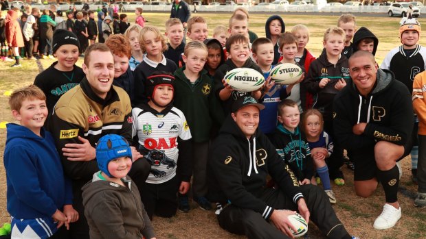 Spreading the word: Penrith players Isaah Yeo, Matt Moylan and Leilani Latu (far right) with children at a recent coaching clinic at Bathurst.