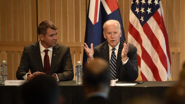 Mr Biden, pictured with Mike Baird, signed a deal for the United States to collaborate with NSW on cancer research.