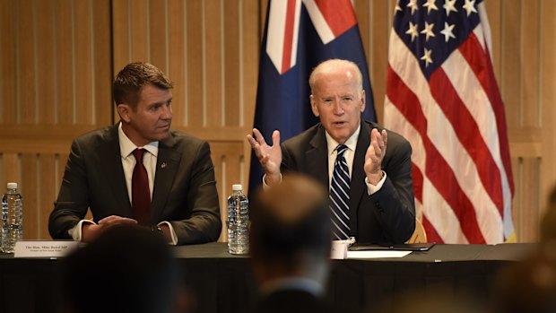 Mr Biden, pictured with Mike Baird, signed a deal for the United States to collaborate with NSW on cancer research.