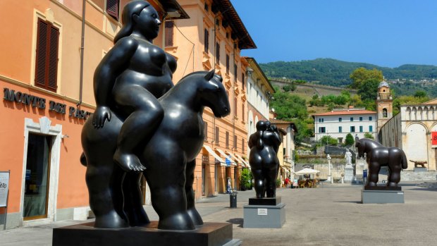 Sculptures by artist Fernando Botero on display in the central square of Pietrasanta Tuscany, Italy.