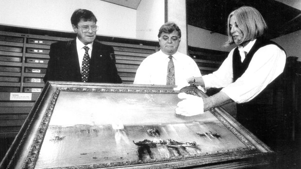 Former National Gallery of Australia chairman Kerry Stokes (left), deputy Brian Johns and director Betty Churcher examine Turner's <i>Camp Santo, Venice</i>, in 1996.