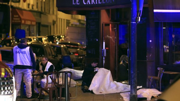 Victims lay on the pavement outside a Paris restaurant.