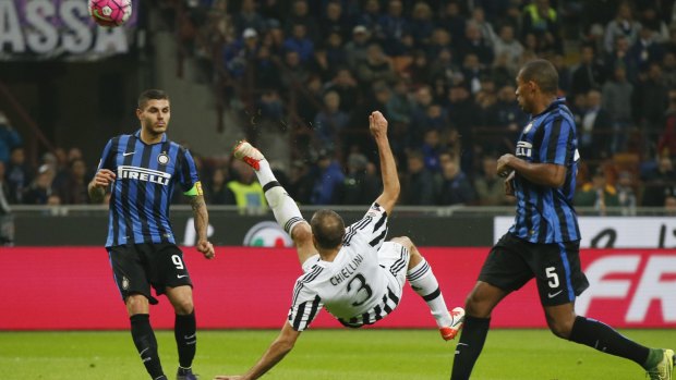 Juventus' Giorgio Chiellini, centre, attempts to score against Inter.