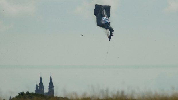 A blimp falls to the ground  during the first round of the US Open golf tournament.