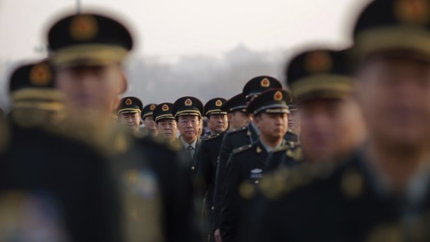 Military delegates arrive for the opening of the annual full session of the National People's Congress at Tiananmen Square in Beijing in March.