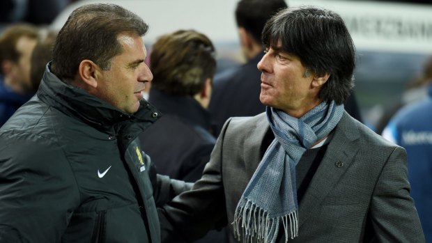 Ange Postecoglou greeted by Joachim Loew of Germany during an international friendly in 2015.