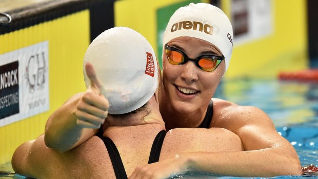 Sisters, rivals: Bronte Campbell, right, celebrates with sister Cate after the women's 100m freestyle during the 2016 Australian Swimming Championships in April.