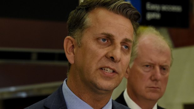Transport Andrew Constance, left, and Sydney Trains CEO Howard Collins address the media on Monday. 
