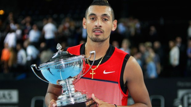 Tour victory: Nick Kyrgios holds his trophy.