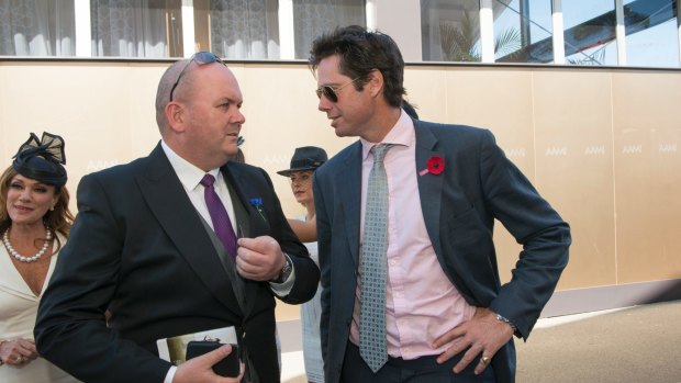 Fiat Chrysler has dropped the vast majority of its allegations against Clyde Campbell (left), chatting with AFL boss Gillon McLachlan.