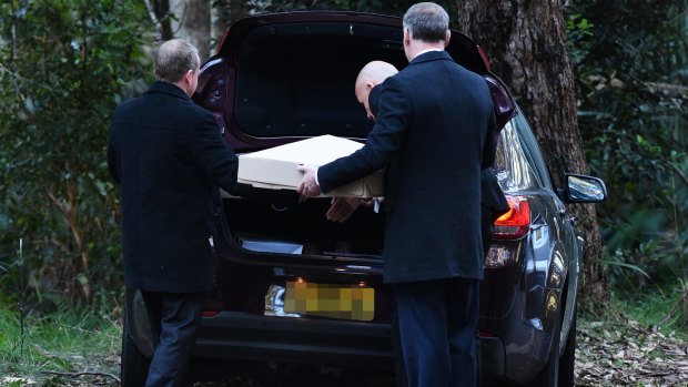 NSW Police detectives remove Matthew Leveson's bones from the Royal National Park.