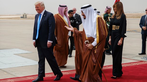 President Trump and Melania Trump are welcomed by King Salman at King Khalid International Airport.