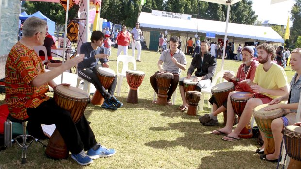 A drumming class at World Refugee Day event in Annerley.