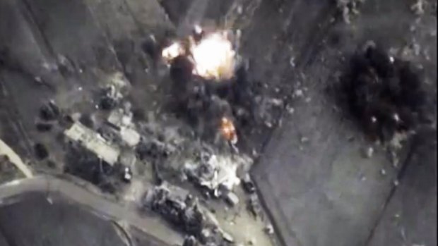 An explosion seen in an October video released by the Russian Defence Ministry purporting to be from air strikes in Syria.