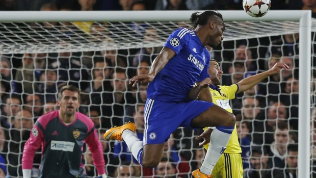 Chelsea's Didier Drogba challenges for the ball.