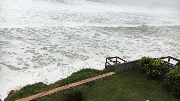 A sinkhole has opened on the lawn in front of Brian Vegh's Collaroy unit.