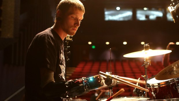 Drummer Jason Barnes with his prosthetic arm which allows him to drum faster than any other human.