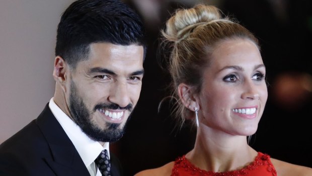 Uruguayan soccer star Luis Suarez and wife Sofia Balbi after attending the wedding of Lionel Messi and Antonella Roccuzzo, in Rosario, Argentina, on Friday.