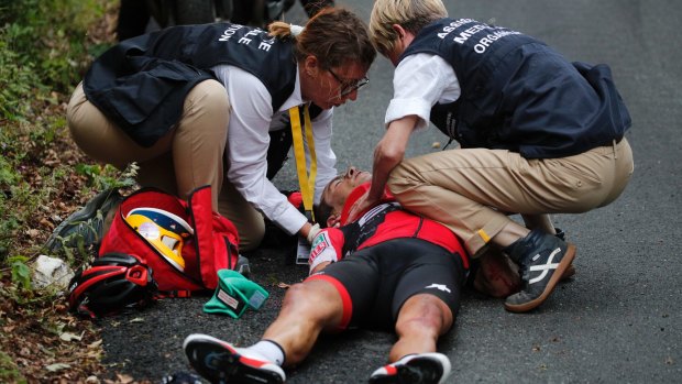 Richie Porte gets medical assistance after crashing during the ninth stage of the Tour de France in 2017.