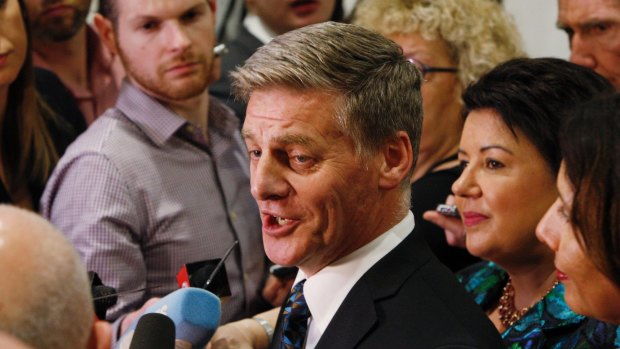Outgoing Prime Minister Bill English talks to reporters on Thursday in Wellington.