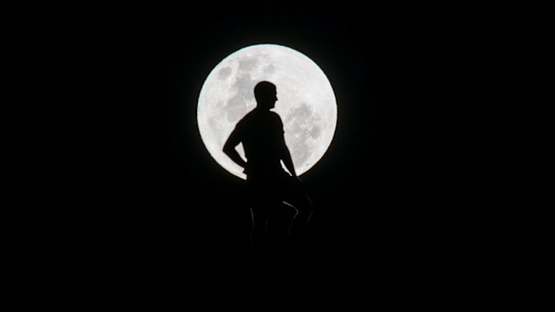 Sheep farmer Gerard Allen watches the rising supermoon in November last year from Cookanalla farm in Fyshwick.