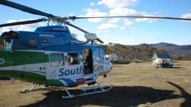 A Snowy Hydro Southcare rescue helicopter sits at Jindabyne Airport, where the 16-year-old pilot was supposed to return to before crashing landing.