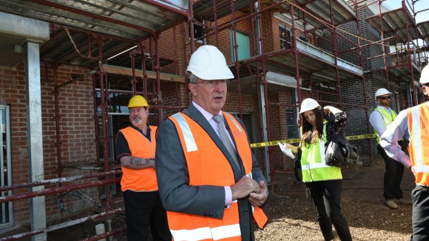 New for old: Brad Hazzard at the site of public housing construction in Lurnea. 