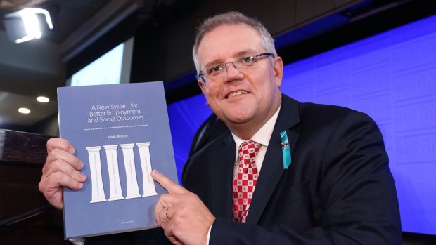 Social Services minister Scott Morrison with the McClure report.
