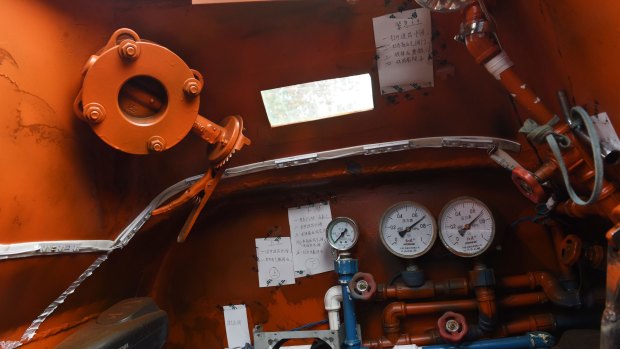 Pride of the chicken farmer: A look inside the home-made orange submarine.