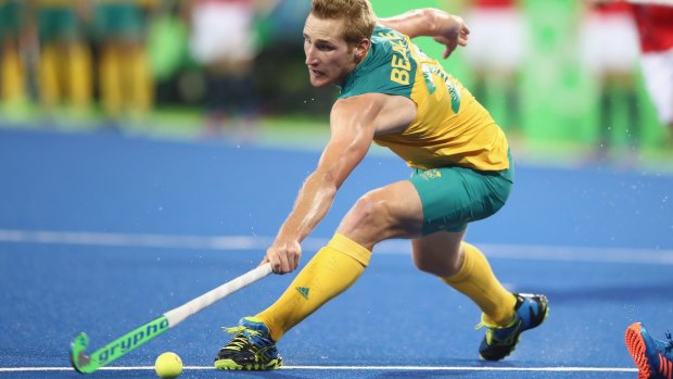 Daniel Beale of Australia stretches for the ball during the men's pool A match between Great Britain and Australia.