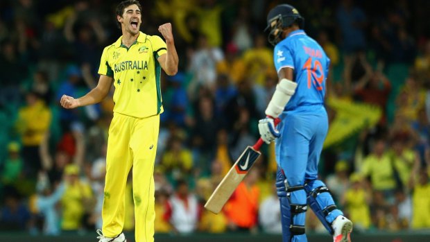 Mitchell Starc of Australia celebrates dismissing Umesh Yadav of India during the 2015 Cricket World Cup Semi Final in Sydney.