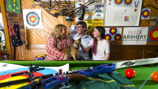 Right on target: The proud family of bronze medal winning archer Alec Potts - parents Shona and Ian,sister Emily, 13 and dog Sunny -celebrate at their Mt Eliza home.