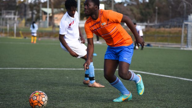 Members of Canberra's refugee, immigrant and asylum seeker community take part in the Refugee Week World Cup in Belconnen, Canberra. Sierra Leone All Stars versus the Multicultural Youth Services All Stars.