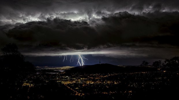 Ian Houghton's shot of an electric storm putting on a display over Canberra won him the summer photo competition.